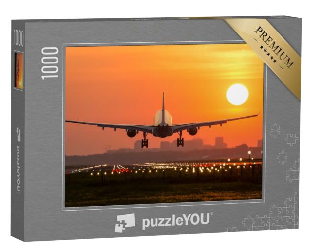 Puzzle 1000 Teile „Passagierflugzeug bei der Landung im Sonnenuntergang“