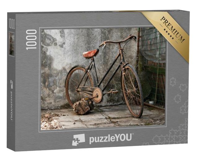 Puzzle 1000 Teile „Altes rostiges Fahrrad vor einer Mauer“