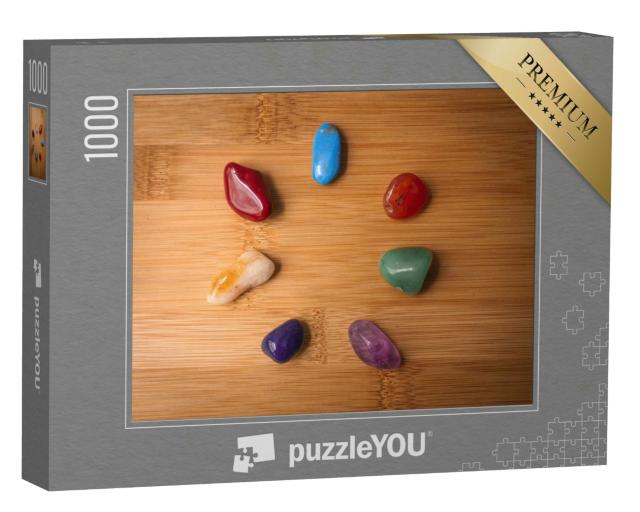 Puzzle 1000 Teile „Sieben Chakra-Steine in einem Holztisch“