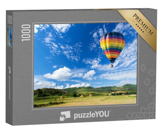 Puzzle 1000 Teile „Heißluftballon über dem Feld mit blauem Himmel“